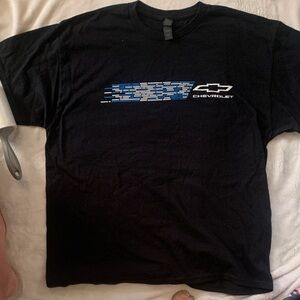 Gildan Chevrolet Black Tee with Blue Graphic.Got it at the 2024 Indianapolis 500